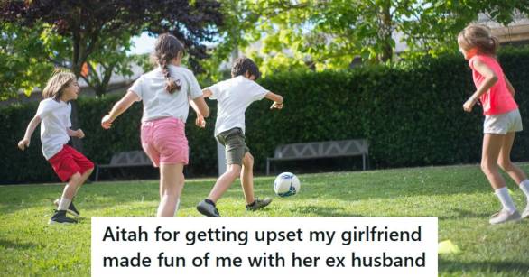 Kids playing soccer at a little league game