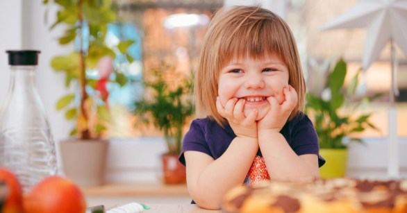 A blonde, smiling child