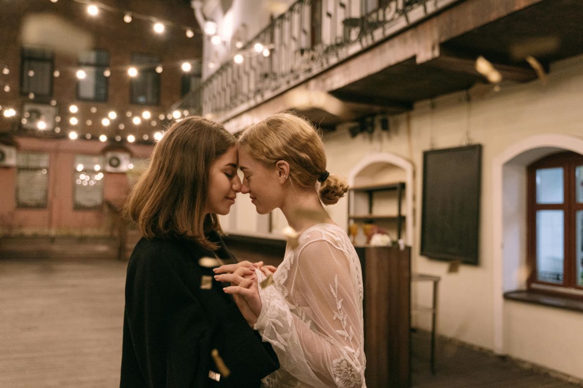 A couple about to kiss in a romantic street