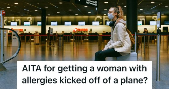 Woman sitting on luggage at airport