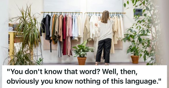Woman browsing clothing rack.