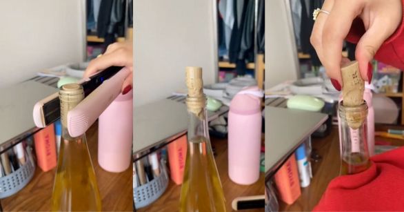 Removing cork from wine bottle with hair straightener