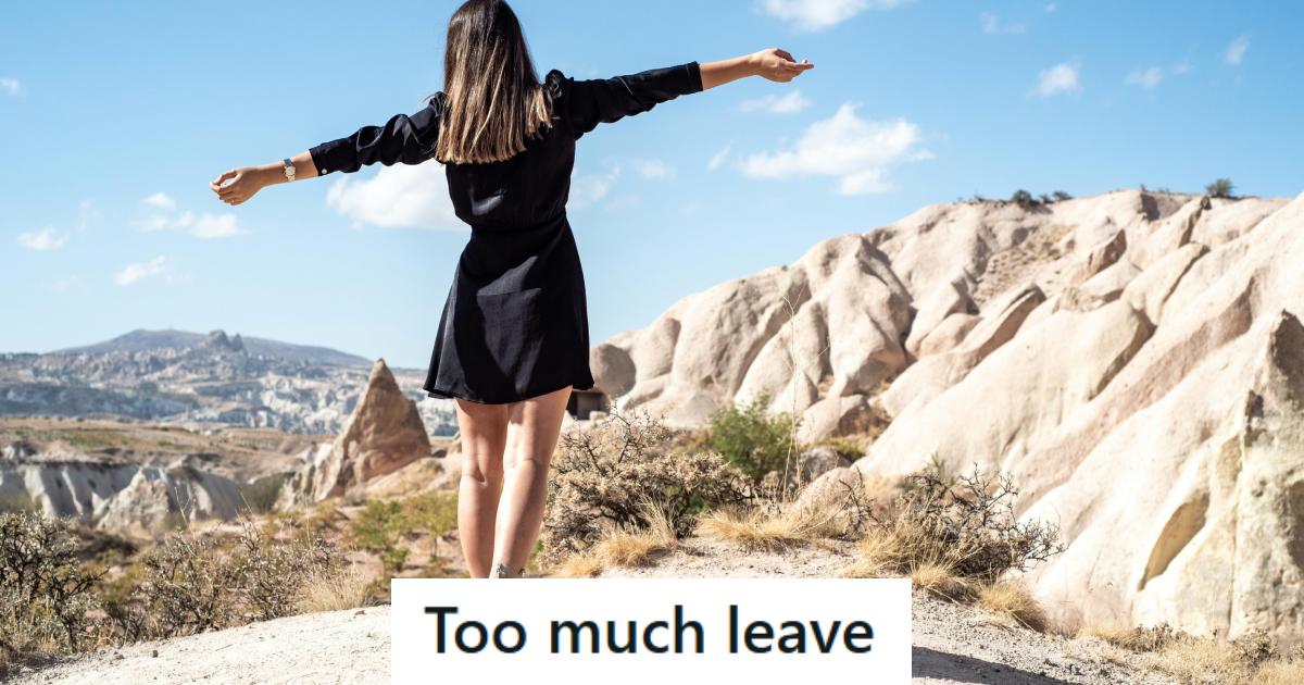 40 year old woman standing on a rock being happy and free