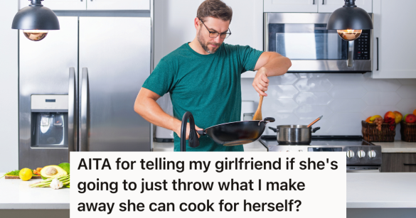 man cooking in a large pan