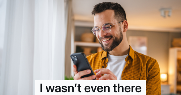 man smiling at his phone
