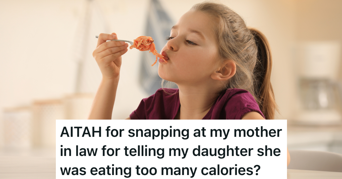 little girl eating pasta