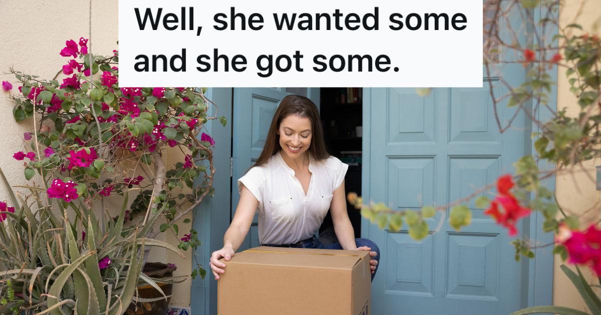 woman picking up a brown box outside her door