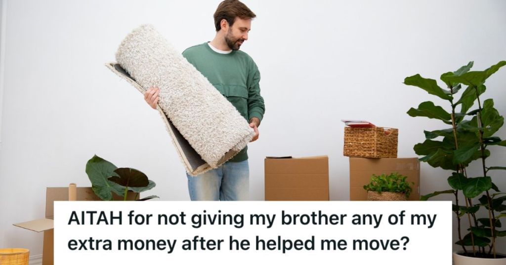 Young man carrying carpet as he is moving to a new place