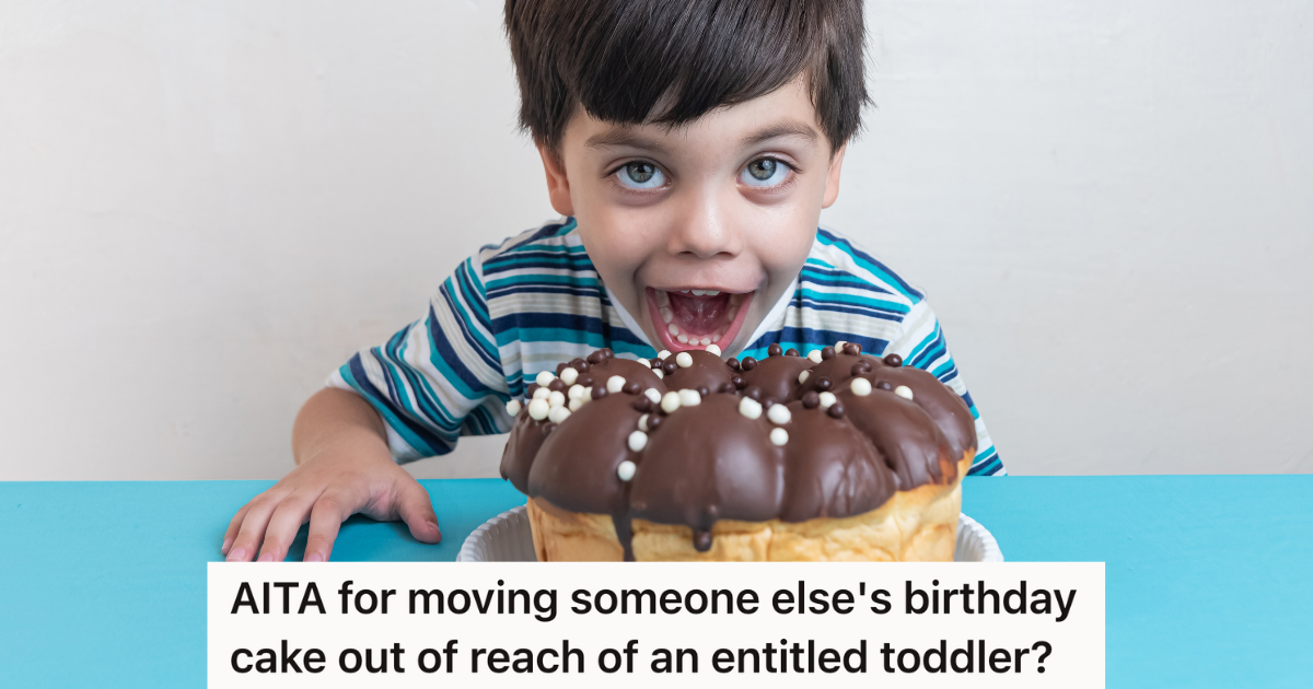 little boy about to bite into a cake