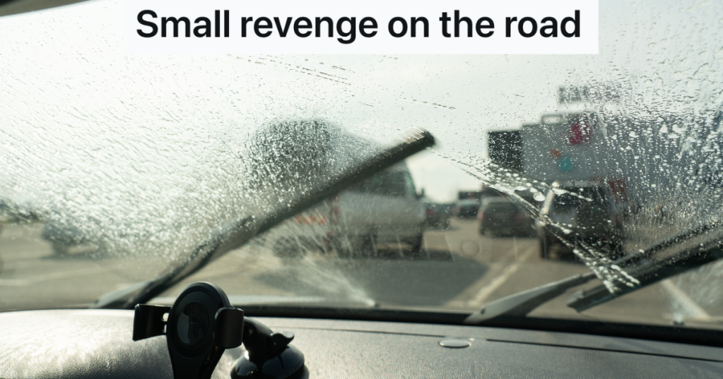 windshield wipers cleaning a car windshield