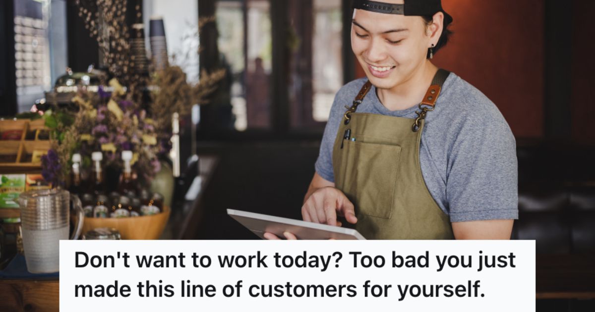 Man working in a store holding a tablet and smilinng