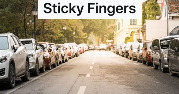 cars parallel parked on both sides of the street