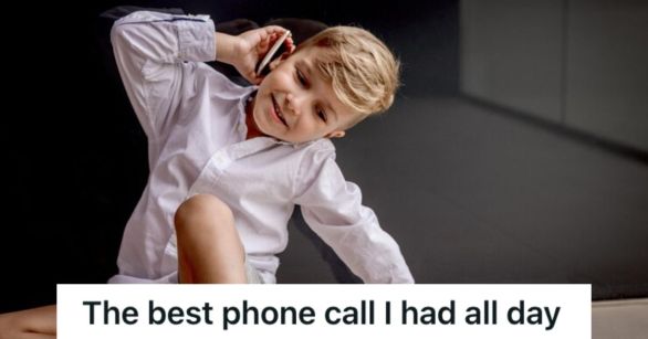 Little boy holding a phone up his ear