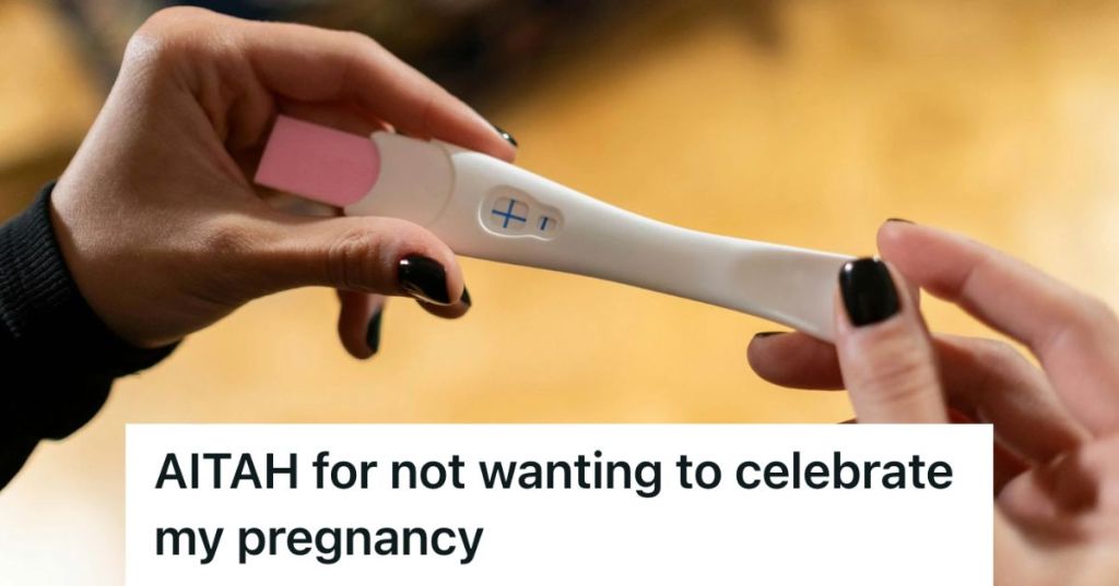 A woman's hands holding a positive pregnancy test