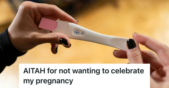 A woman's hands holding a positive pregnancy test