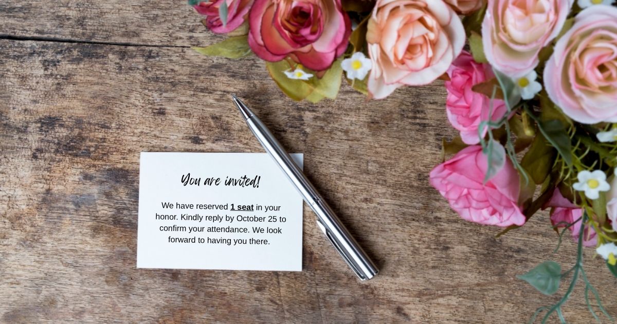 Woman Is Planning A Small Wedding With Her Fiancé, So She Didnt Give Her Future Sister In Law A Plus One An RSVP card and a pen with flowers on the side