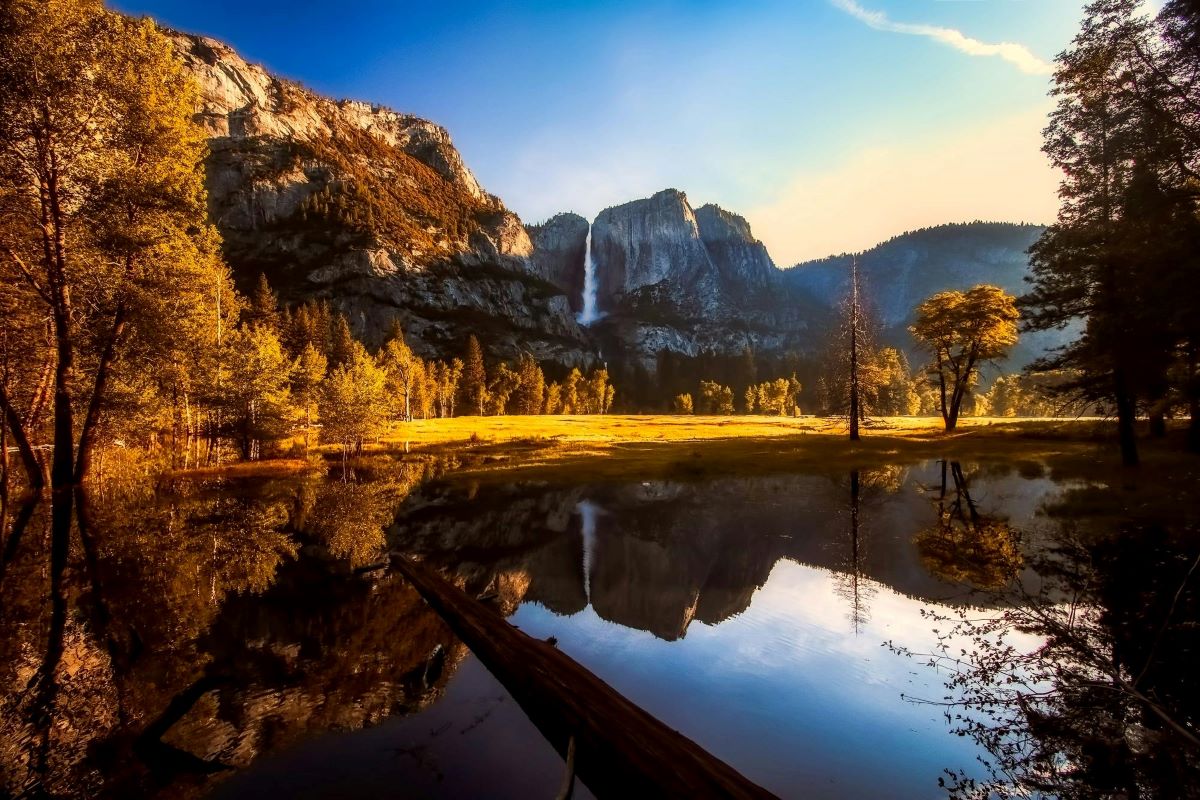 A lake, trees, waterfall and mountains at Yosemite