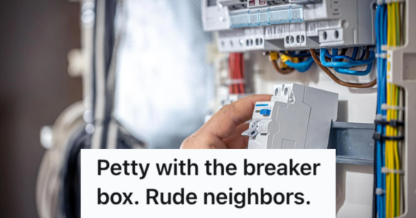 A person's hand touchinga switch in the breaker box of an apartment