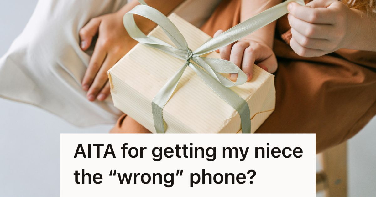 girl opening up a nice gift with a bow on it