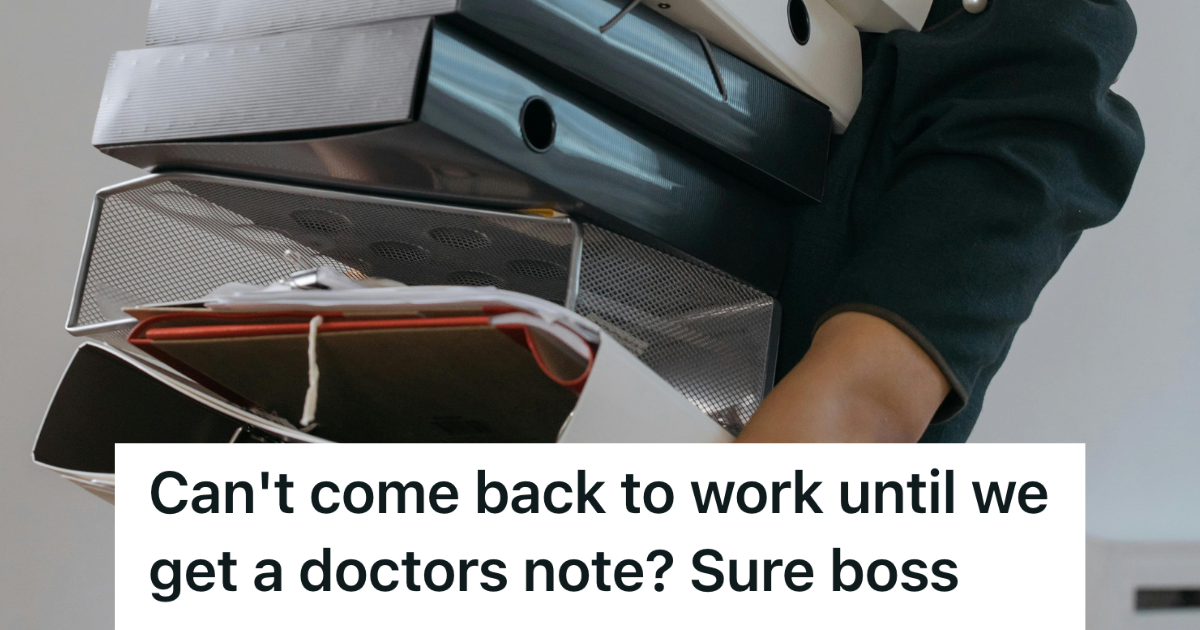 person carrying a stack of binders