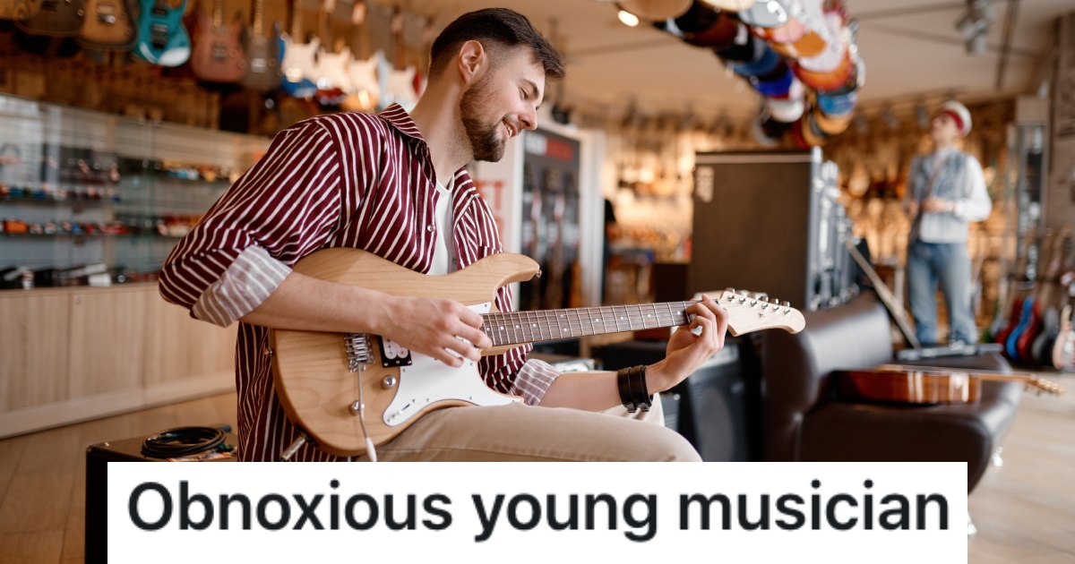 man playing guitar in a music store