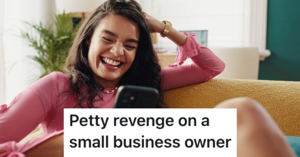 woman laughing looking at her phone