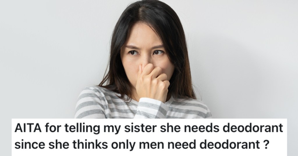 woman holding her nose