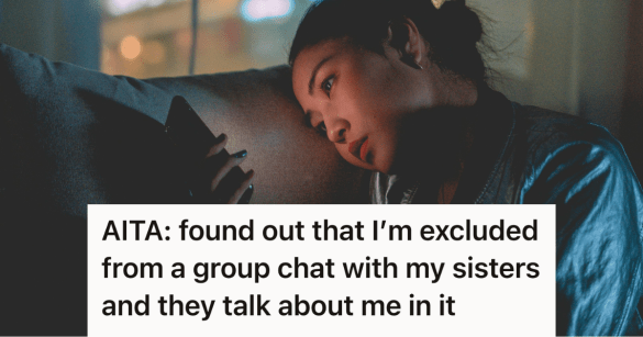 woman sad looking at her phone in a dark room