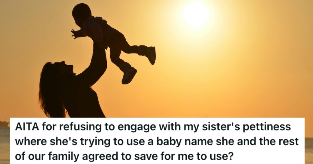 A baby held in the air against a sunset