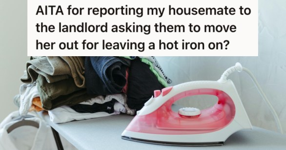 An iron beside a pile of clothes