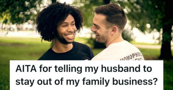 A mixed race couple smiling in a park