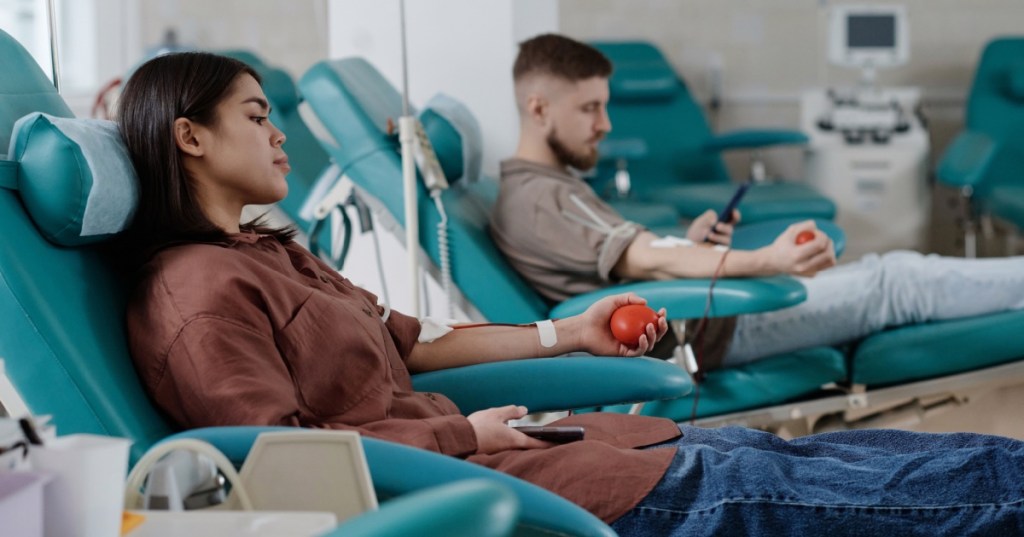 Man and woman donating blood