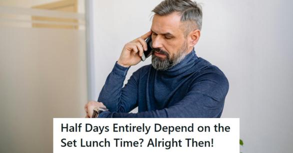 Man working from home and looking at his watch for the time