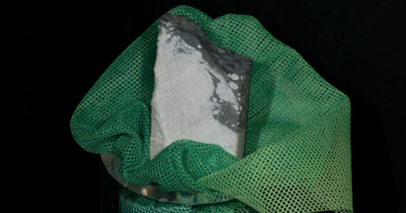 The mineral jadarite in green cloth