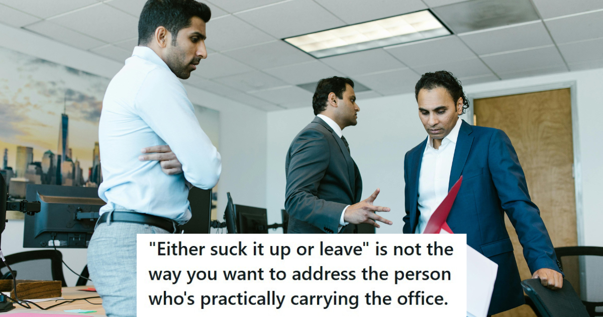 Three men standing in an office