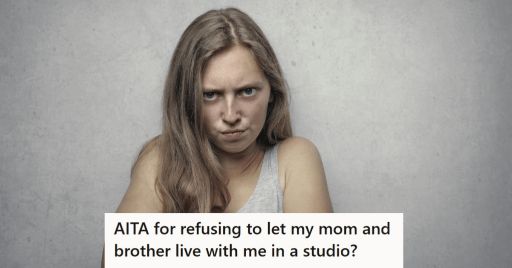 Woman angry in front of grey background