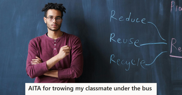 Boy in red shirt standing in front of a black board