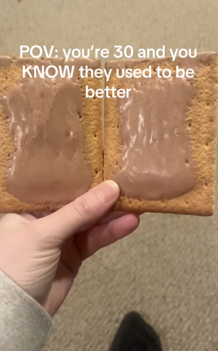 woman holding two pop tarts