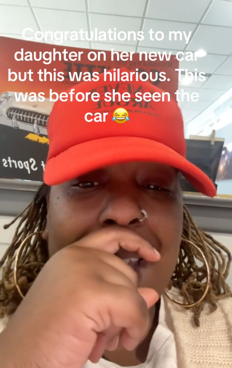 woman trying not to laugh