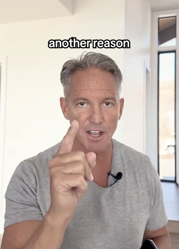 man pointing at a camera