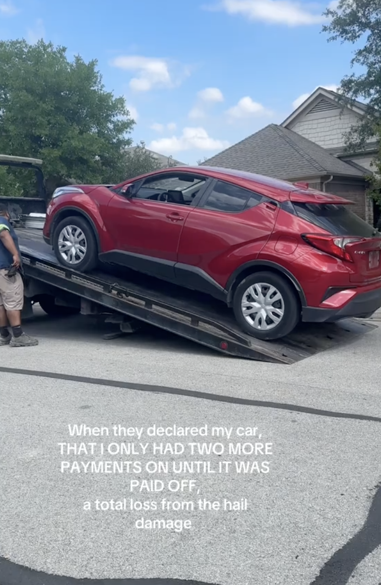 car being loaded onto a tow truck