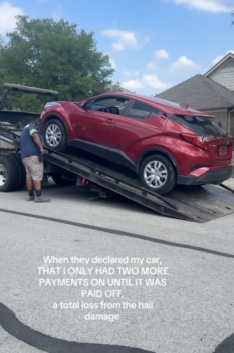 car being loaded onto the back of a tow truck