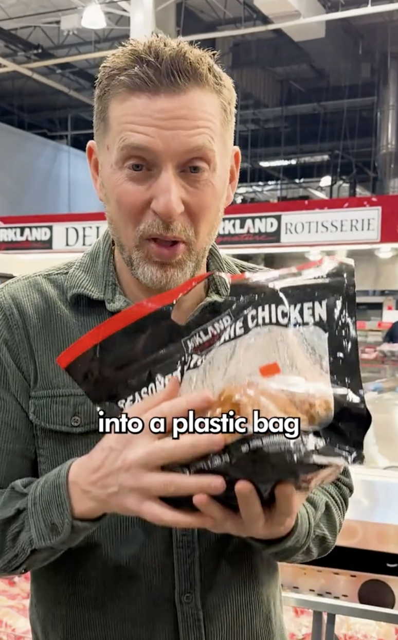 man holding a costco chicken