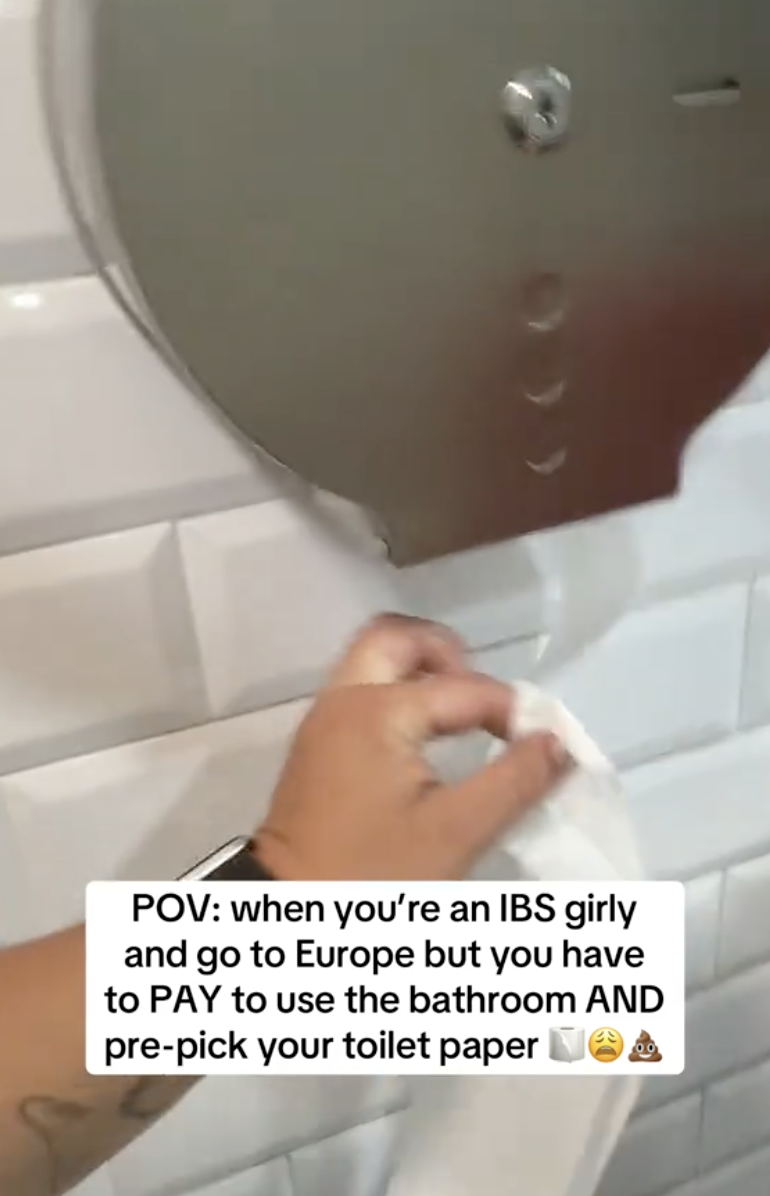 woman grabbing toilet paper