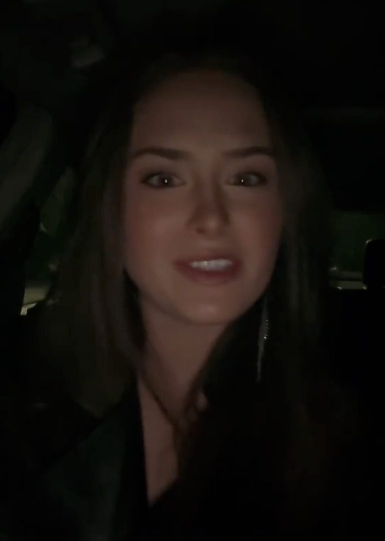 woman sitting in her car