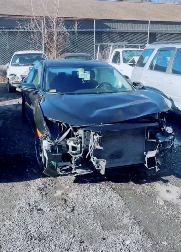a wrecked honda car