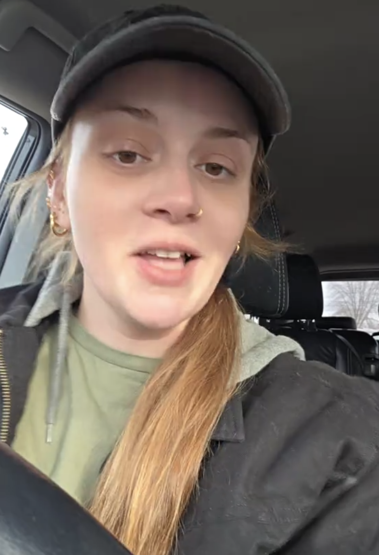 woman sitting in her car