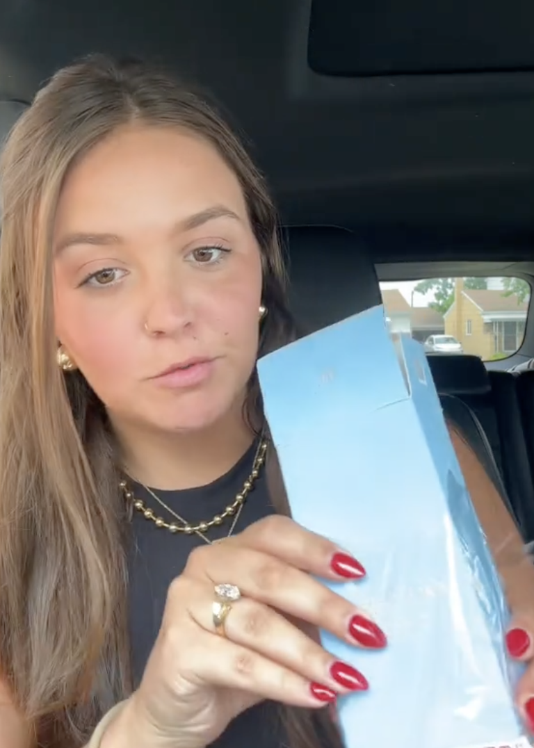 woman sitting in her car