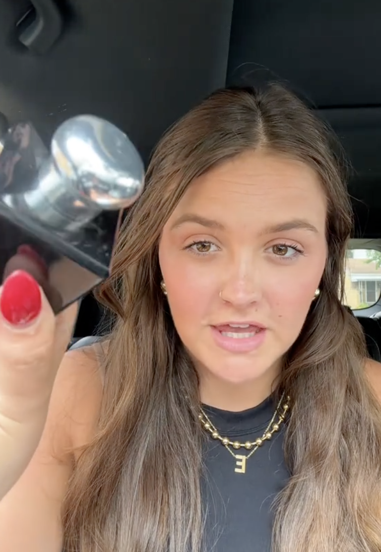 woman sitting in her car