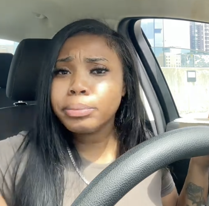 woman sitting in her car